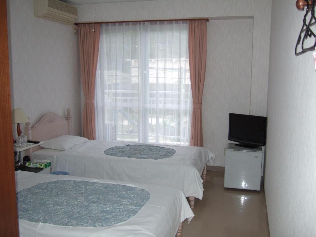 زمامي Pension Takatsuki الغرفة الصورة
